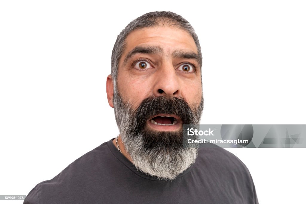 Mature handsome man over isolated background afraid and shocked with surprise expression, fear and excited face. Mature handsome man over isolated background afraid and shocked with surprise expression, fear and excited face. isolated on white. Eye Stock Photo