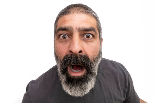 istock Mature handsome man over isolated background afraid and shocked with surprise expression, fear and excited face. 1391954114