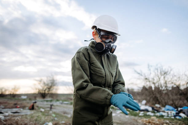 istock The ecologist wearing rubber gloves for protection 1391954357