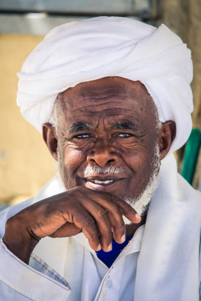 Local Eritrean Man in Traditional White dress on the Keren Camel animal Market Keren, Eritrea - November 03, 2019: Local Eritrean Man in Traditional White dress on the Keren Camel animal Market eritrea stock pictures, royalty-free photos & images