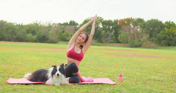 istock girl practice yoga with dog 1391961038