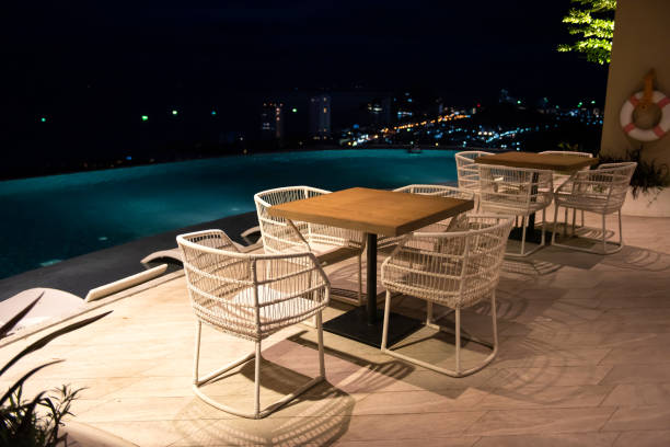 istock Hotel rooftop pool at night with blur cityscape 1391962257