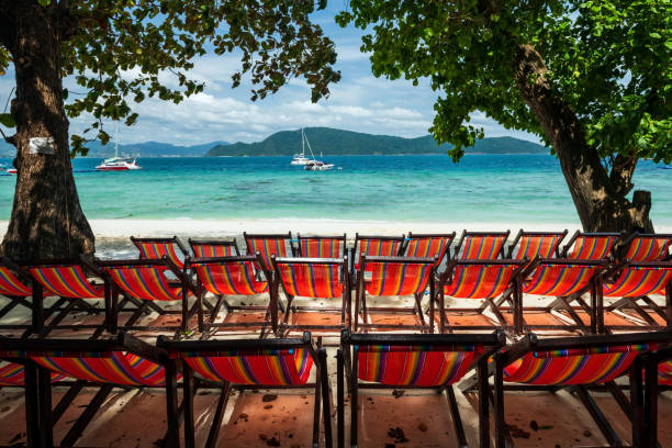 istock Rainbow beach deckchairs at Hey island, Phuket, Thailand 1391962273