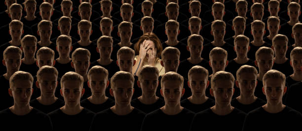 istock Conceptual creative collage with grey crowd of identical people and special one man standing among them. Difference and diversity concept. 1391965255