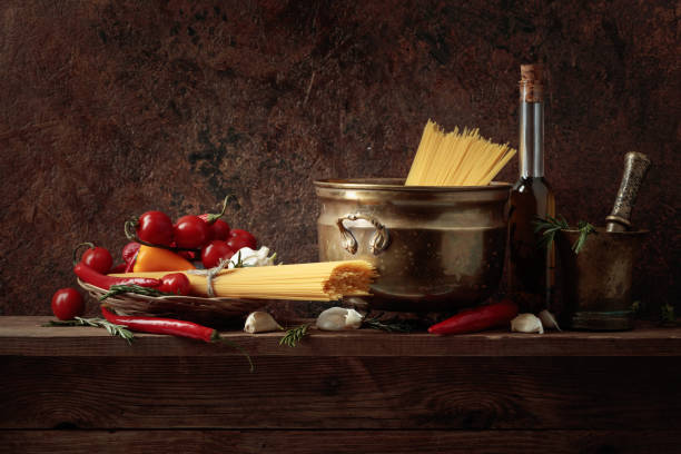 istock Pasta with ingredients on a old wooden table. 1391966276