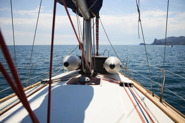 Sailing yacht moves along the coast of the Black Sea stock photo