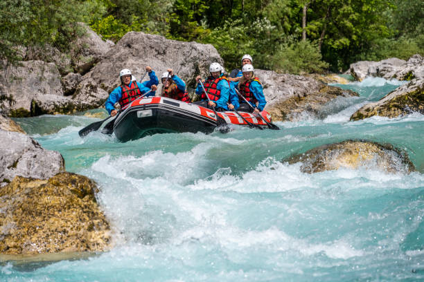 istock Raft raiders preparing to go down through challenging rapids, enjoying activity in nature on sunny day 1391967814