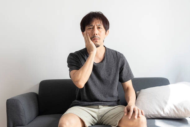 istock Adult asian man suffer from sensitive toothache. 1391968579
