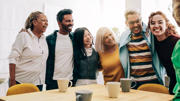 istock Multiracial people having fun inside home kitchen - Multi-generational friends concept - Focus on African senior woman 1391968999
