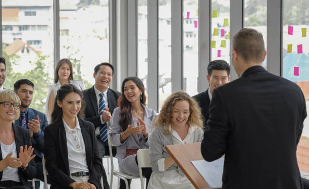 istock Happy audience in corporate seminar event 1391969894
