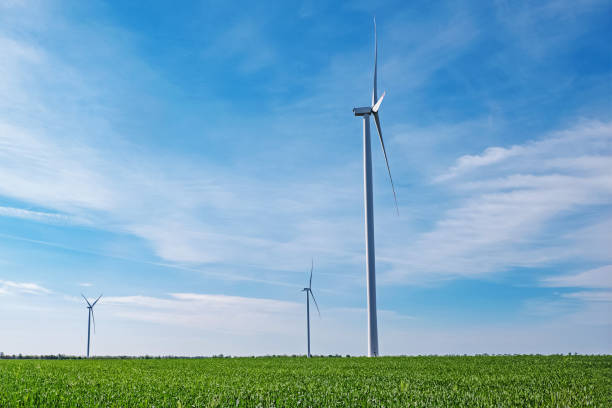 istock Electrical wind power mills over the blue sky 1391969895