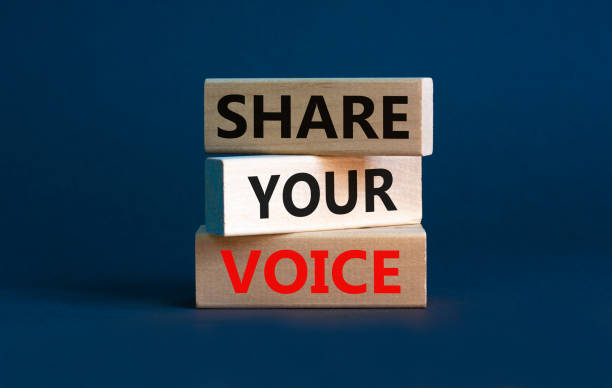 Share your voice symbol. Concept words Share your voice on wooden blocks. Beautiful grey background. Business share your voice concept. Copy space. stock photo