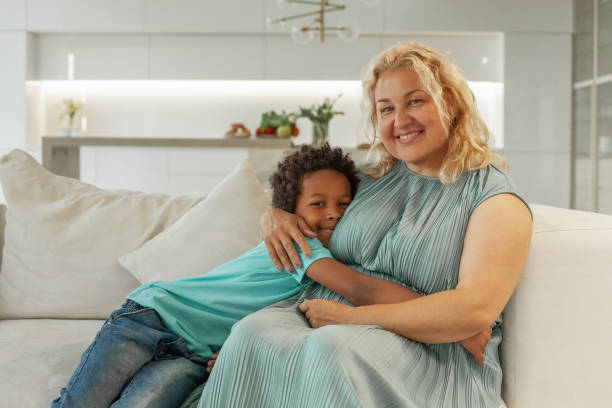 istock Mother sitting with son at home 1391970230