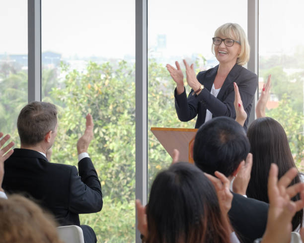 istock Cheerful senior businesswoman clapping hands for achievement. 1391970430