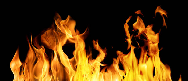istock yellow fire hot stripe isolated on black 1391970937