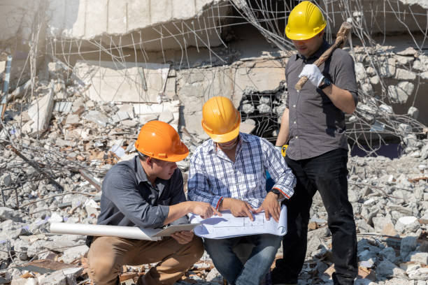 istock Demolition control supervisor and contractor discussing on demolish building. 1391970939