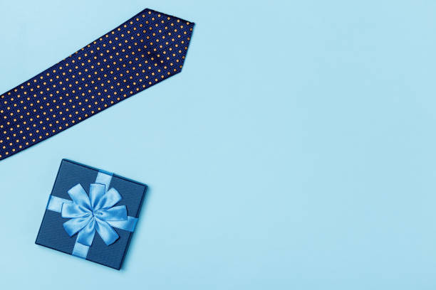 istock Fathers day concept. Gift tie on a blue background. Top view flat lay copy space 1391971314