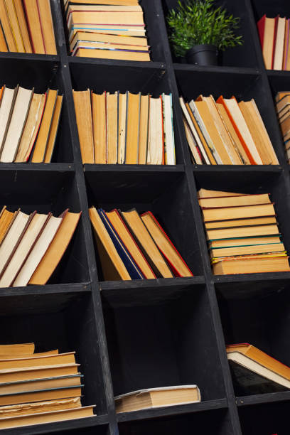 istock many books with yellowed pages lie on a dusty shelf 1391972270