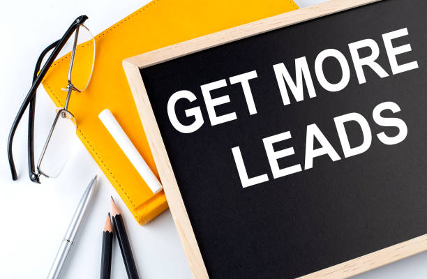 istock GET MORE LEADS text on the blackboard with notepad , pen, pencil 1391972274