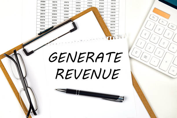 istock Text GENERATE REVENUE on the white paper on clipboard with chart and calculator 1391972284