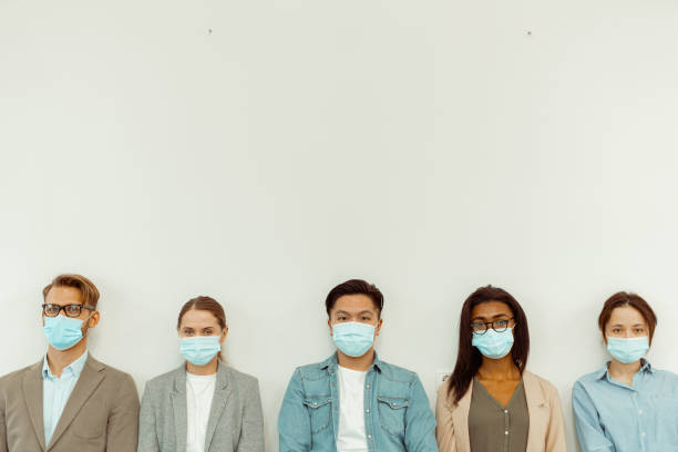 istock Business people standing on the white wall background 1391972841