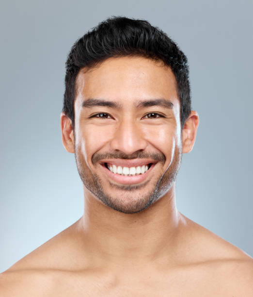 istock Shot of a handsome young man posing against a grey background 1391974172