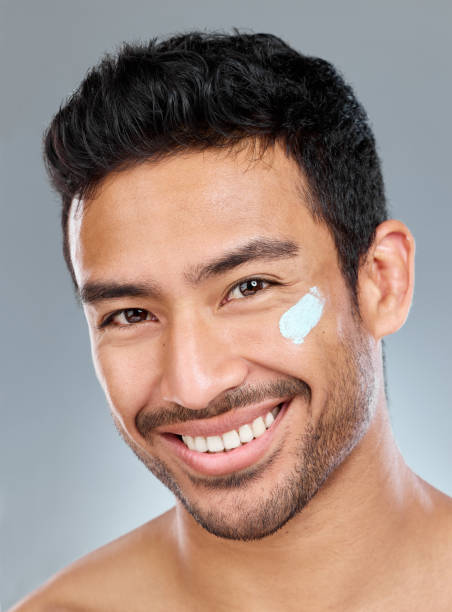 istock Shot of a man posing with moisturiser on his face 1391974203