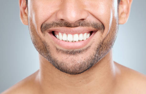 istock Cropped shot of a man smiling while standing against a grey background 1391974226