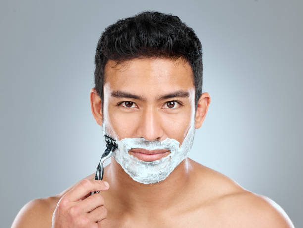 istock Studio shot of a man shaving with a disposable razor 1391974294
