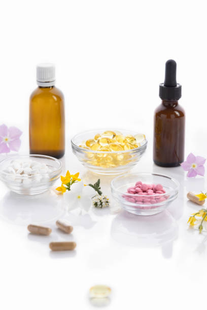 istock Various vitamin capsules and dietary supplements isolated on white background, vertical format. Vitamin complexes concept. 1391975074