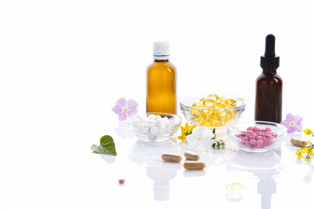 istock Various vitamin capsules and dietary supplements isolated on white background with copy space. Vitamin complexes concept. 1391975080