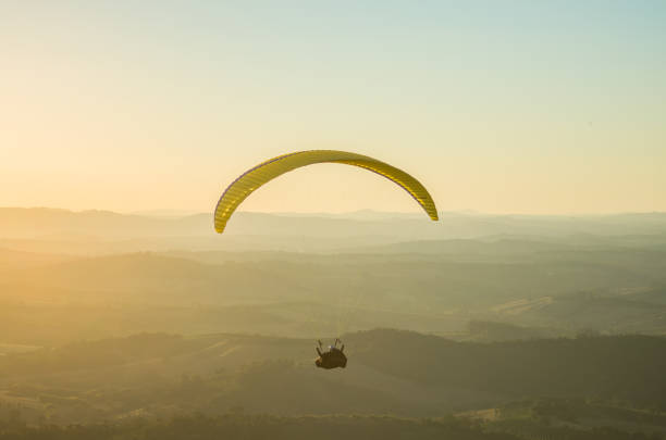 istock Paraglider flying solo during sunset 1391975265