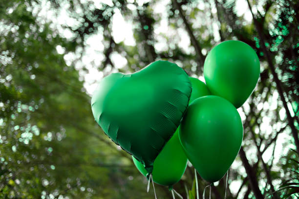 green colored balloons - birthday party and revelation tea stock photo
