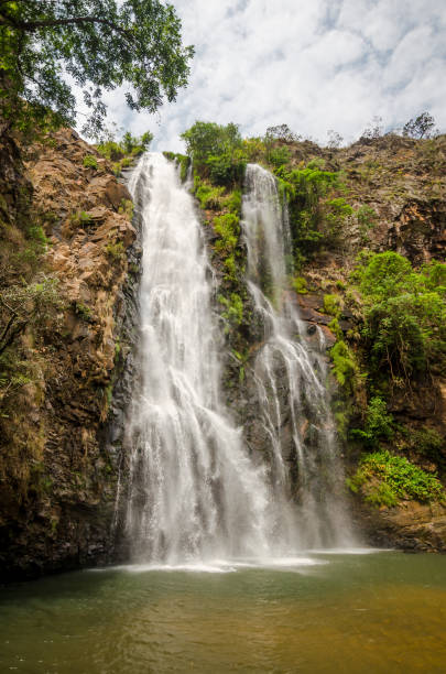 istock Very tall waterfall in tropical weather 1391978671