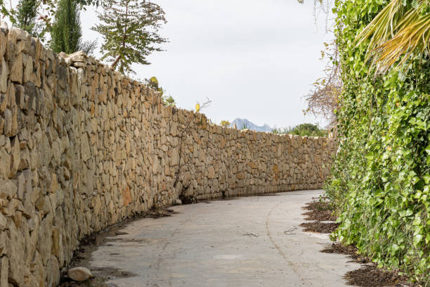 istock Picturesque path with rock walls 1391978742