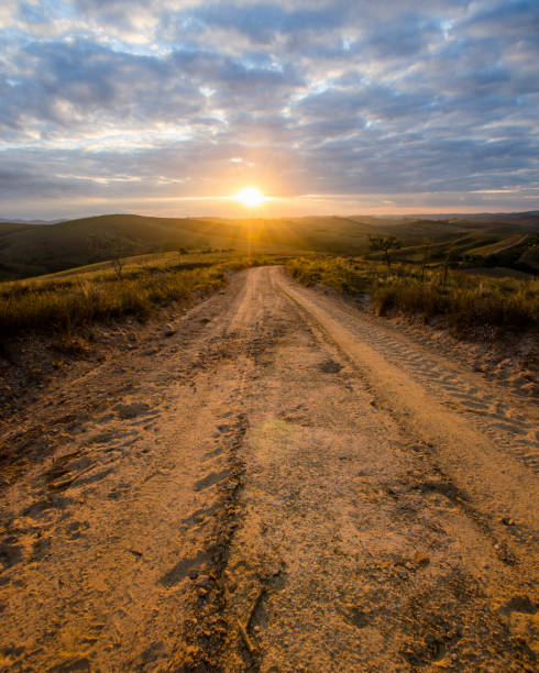 istock Dirt road to sunset 1391981900