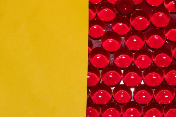 half yellow half red with beads modern background, creative art futuristic design and yellow part as copy space, love summer composition