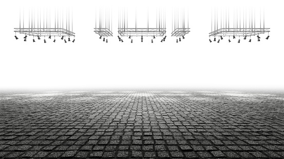 Sidewalk cobblestone. Stage with spotlights and white light. Empty space background. Isolated. Empty street.