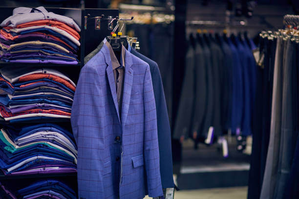 istock Men's jackets on hangers in the men's store. 1391987678