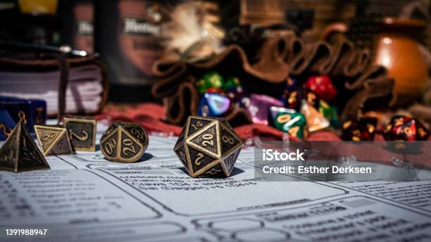Low Angle Image Of A Brass D20 Stock Photo - Download Image Now - Dragon, Dungeon, Board Game