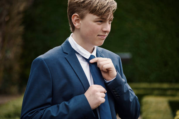 istock Teenager dressed for his communion 1391991319