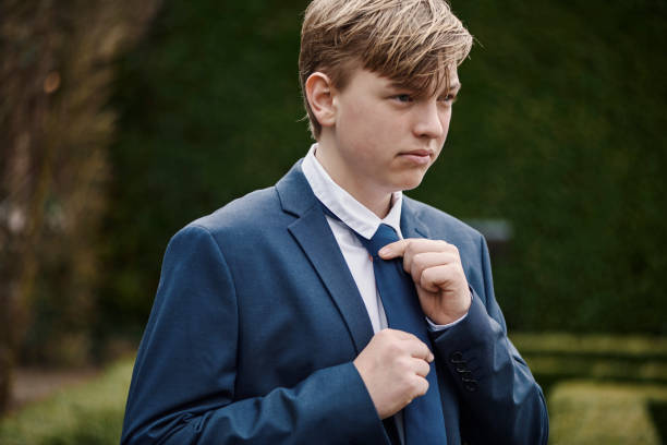 istock Teenager dressed for his communion 1391991330