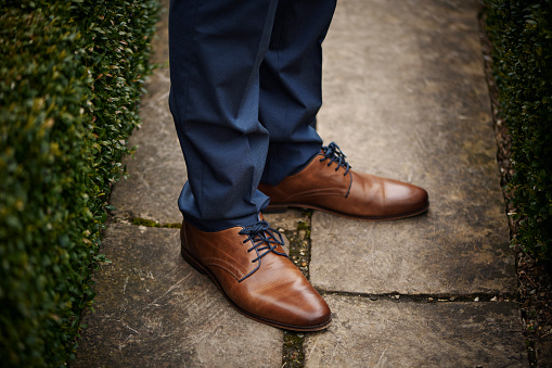 Lutheran Protestant communion. Portrait of teenager in his confirmation suit. Fourteen year old boy in new shoes