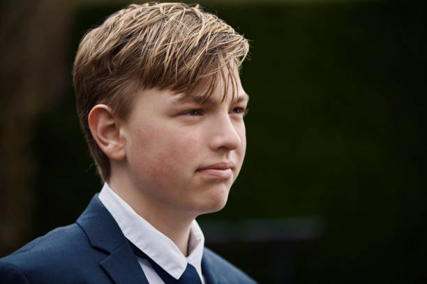istock Teenager dressed for his communion 1391991396