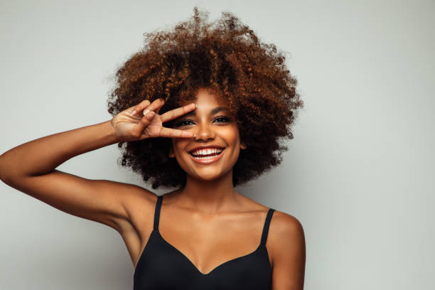 istock Beautiful afro woman with perfect make-up 1391993156