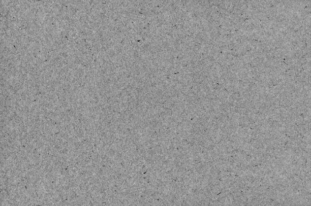 istock Grey natural art paper texture background, recycled craft pattern, large bright horizontal vintage rustic retro album wrapping cardboard sheet, decorative spotted handmade detailed grungy wood fibre macro closeup, dark old aged textured blank empty grunge 1391993240