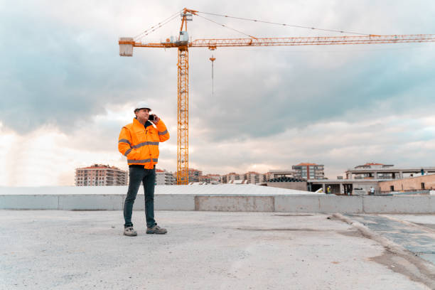 engineer inspection at construction site - manual worker portrait helmet technology imagens e fotografias de stock