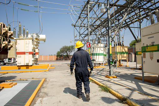 electrical workers in substation, inspection