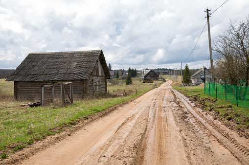 Russian village in spring, dirty country road