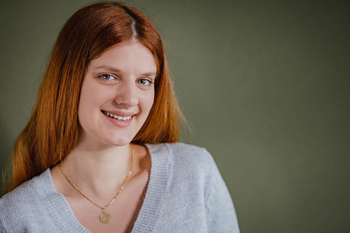 Young woman smiling and looking at camera